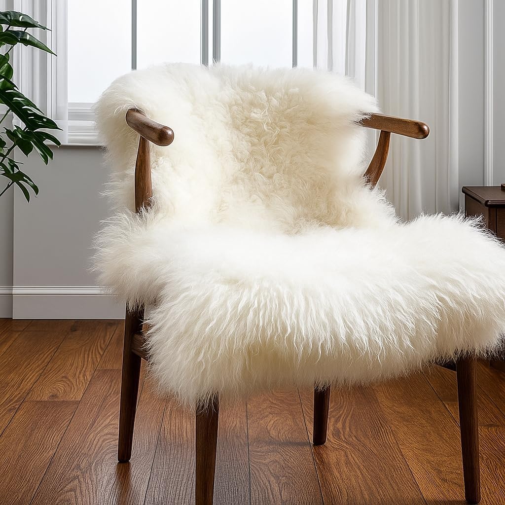 Ivory sheepskin rug draped over a wooden armchair beside a bright window